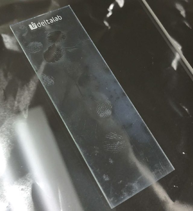 Parylene coated slide after 10 minutes of oxygen plasma with two cleared spots