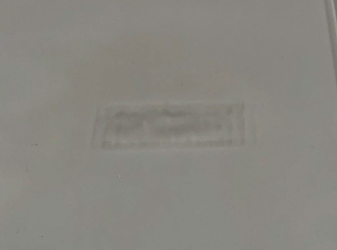 Faint residue of silicone adhesive left after 3.5 hours of plasma ashing
